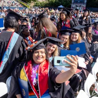 Graduating students taking a selfie